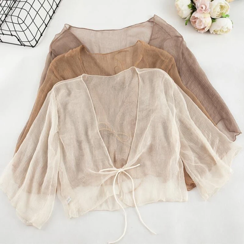 Women Summer Thin Sheer Shiny Chiffon Short Shirt Lace-Up Cropped Kimono Cardigan Black White Beige Khaki Cover Up Shrug Jacket
Women Summer Thin Sheer Shiny Chiffon Short Shirt Lace-Up Cropped Kimono Cardigan Black White Beige Khaki Cover Up Shrug Jacket