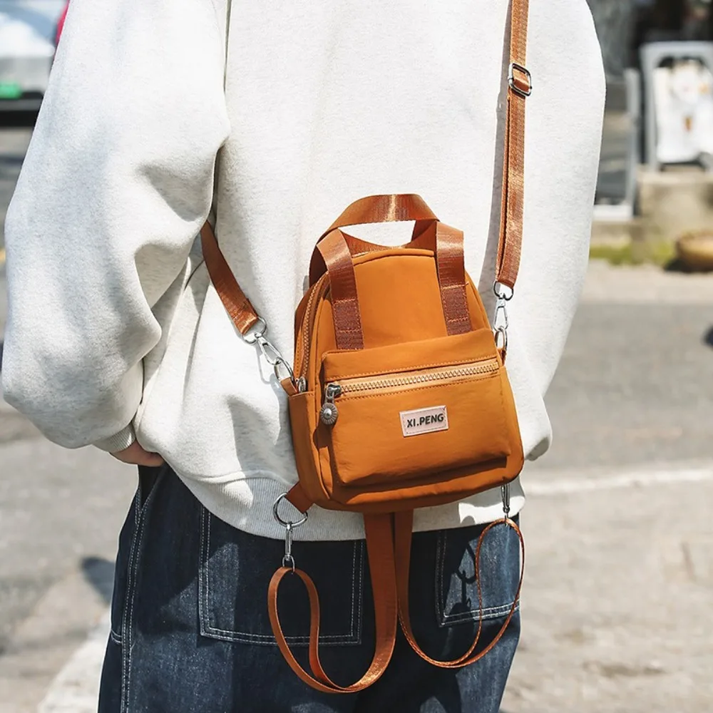 Multifunctional Crossbody Phone Pouch Korean Style Handheld Nylon Shoulder Bag Tote Bag Solid Color Small Square Bag Outdoor
Multifunctional Crossbody Phone Pouch Korean Style Handheld Nylon Shoulder Bag Tote Bag Solid Color Small Square Bag Outdoor