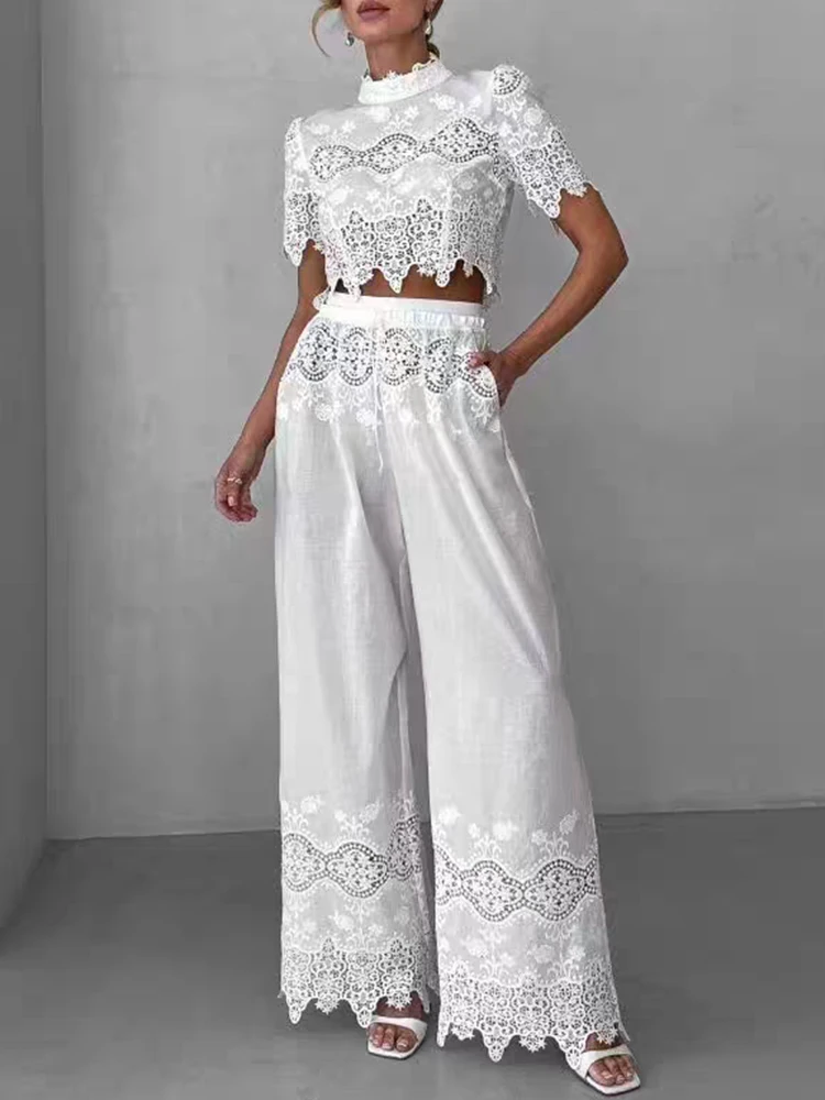 Embroidered and hollowed-out back zipper short top two-piece set for 2025 Summer women's wear + elastic waist wide-leg pants set
Embroidered and hollowed-out back zipper short top two-piece set for 2025 Summer women's wear + elastic waist wide-leg pants set