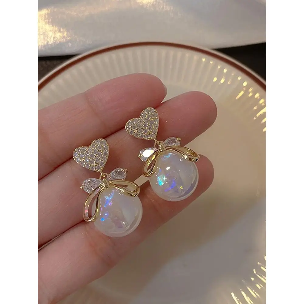 Elegant Faux Pearl Bowknot Heart DiamondEncrusted Mermaid Princess Earrings For Sweet Luxury Date Night
Elegant Faux Pearl Bowknot Heart DiamondEncrusted Mermaid Princess Earrings For Sweet Luxury Date Night