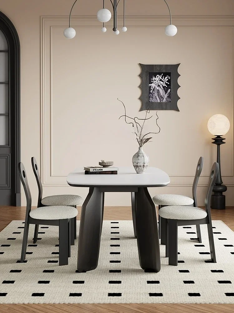 A Minimalist rock slab dining table light luxury simple oak home French retro dining table
A Minimalist rock slab dining table light luxury simple oak home French retro dining table