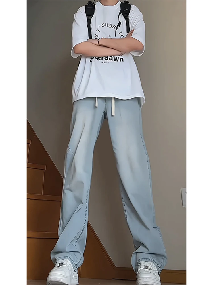 Светло-голубые джинсы из ледяного шелка для мужчин, с эластичным поясом, высокой посадкой, удлиненные, летние, приталенные, прямые, модные, повседневные
Светло-голубые джинсы из ледяного шелка для мужчин, с эластичным поясом, высокой посадкой, удлиненные, летние, приталенные, прямые, модные, повседневные