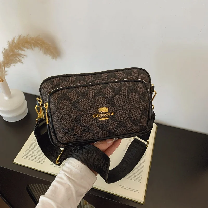 Classics Original Circular-Pattern Logo Crossbody: Retro-luxury, durable fabric, adjustable strap. Ideal for daily/work/social u
Classics Original Circular-Pattern Logo Crossbody: Retro-luxury, durable fabric, adjustable strap. Ideal for daily/work/social u