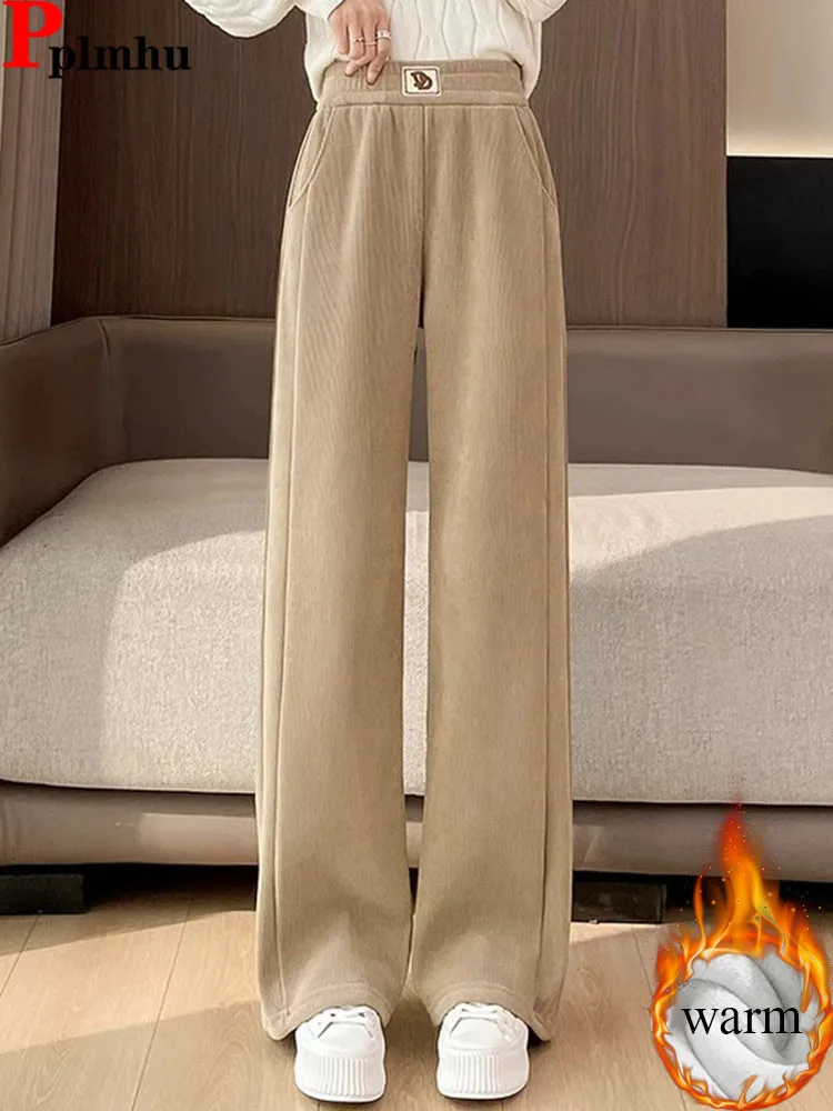 Зимние теплые свободные прямые брюки, корейские модные эластичные спортивные штаны с высокой талией на бархатной подкладке, женские повседневные утепленные брюки
Зимние теплые свободные прямые брюки, корейские модные эластичные спортивные штаны с высокой талией на бархатной подкладке, женские повседневные утепленные брюки