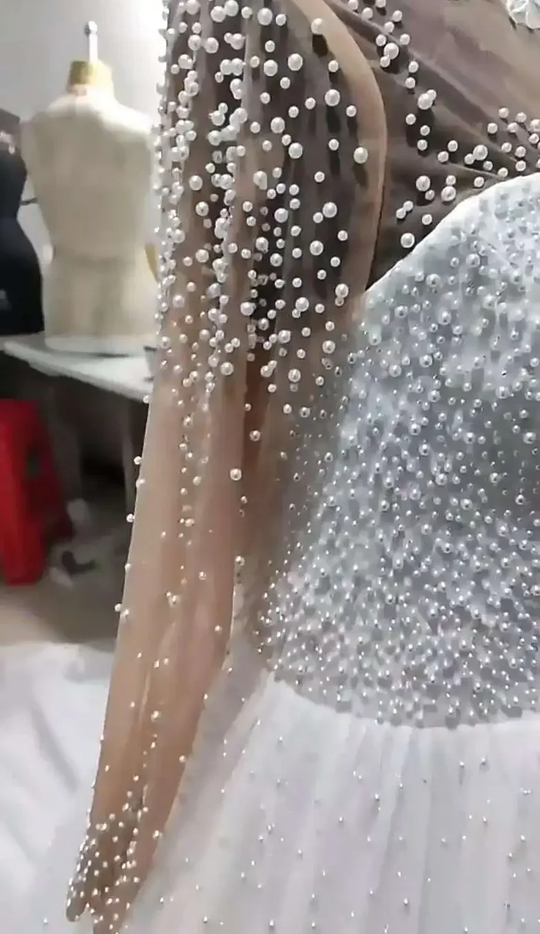 Свадебное платье с блестящим жемчугом по индивидуальному заказу, Vestido De Casamento, роскошное бальное свадебное платье с длинными рукавами в африканском стиле
Свадебное платье с блестящим жемчугом по индивидуальному заказу, Vestido De Casamento, роскошное бальное свадебное платье с длинными рукавами в африканском стиле