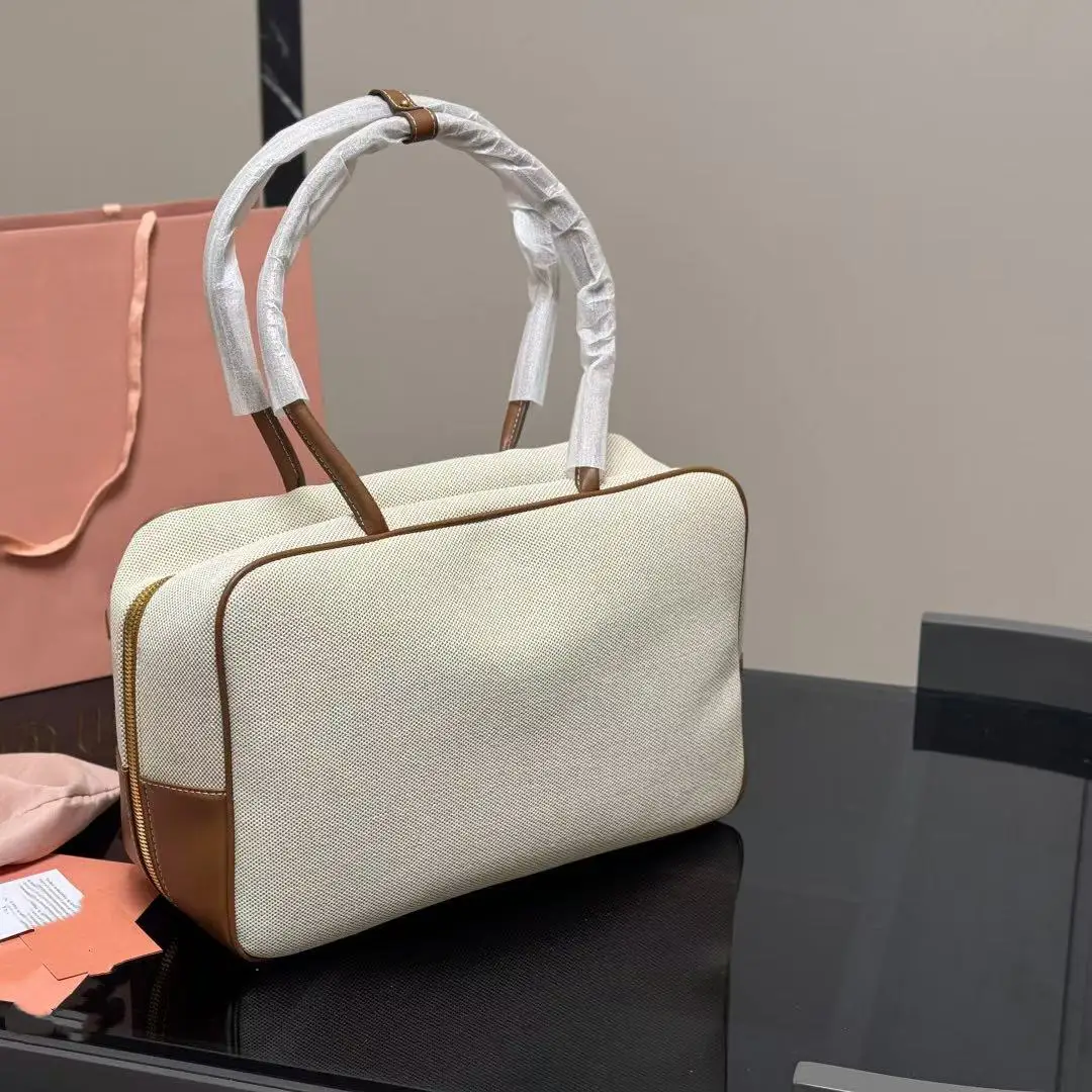 High-quality rectangular bags women 2025 new canvas leather briefcase contrast portable bowling handbag large capacity handbag 
High-quality rectangular bags women 2025 new canvas leather briefcase contrast portable bowling handbag large capacity handbag