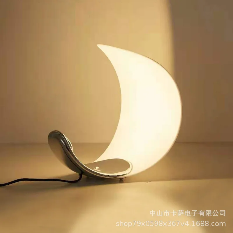 Modern simple moon table lamp Nordic light luxury high-end girl room atmosphere light bedroom bedside decorative lamp
Modern simple moon table lamp Nordic light luxury high-end girl room atmosphere light bedroom bedside decorative lamp