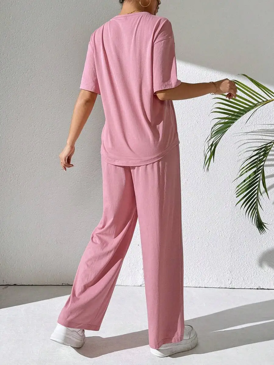 Womens Pink Two-Piece Loose Fit Short Sleeve Tee And Wide Leg Pants Set For Casual Daily Wear, Home, Or Light Activity
Womens Pink Two-Piece Loose Fit Short Sleeve Tee And Wide Leg Pants Set For Casual Daily Wear, Home, Or Light Activity