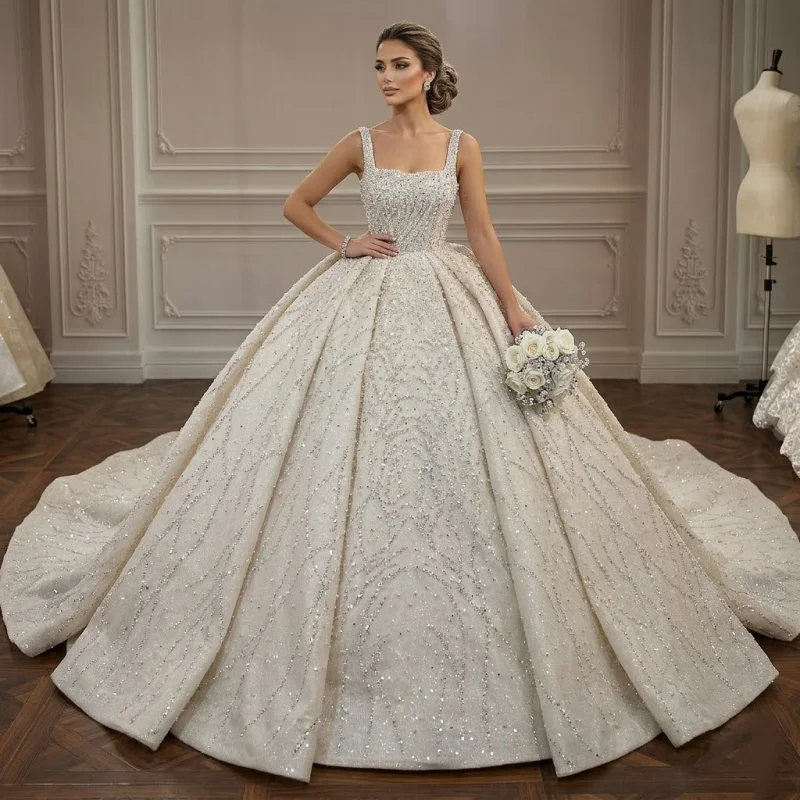 Custom Luxury Square Neck Beaded Ball Gown Wedding Dress 2026 Sparkly Cathedral Train Bridal Gown Plus Size Vestido De Novia
Custom Luxury Square Neck Beaded Ball Gown Wedding Dress 2026 Sparkly Cathedral Train Bridal Gown Plus Size Vestido De Novia
