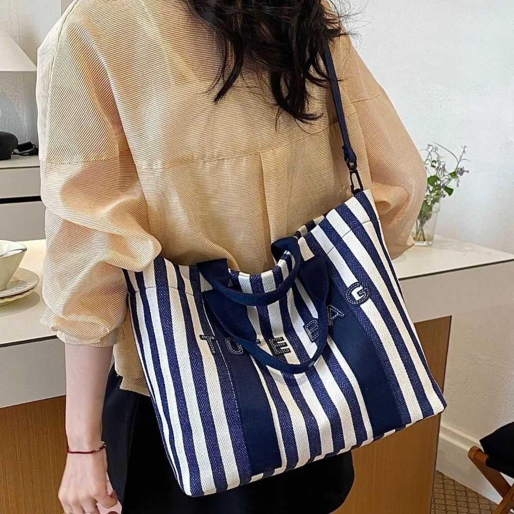 Simple Cloth Stripe Canvas Tote Bag Trendy Casual Korean Style Shoulder Bag Lightweight Crossbody Strap Large Capacity Handbag
Simple Cloth Stripe Canvas Tote Bag Trendy Casual Korean Style Shoulder Bag Lightweight Crossbody Strap Large Capacity Handbag