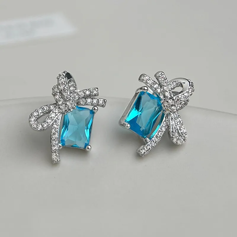 Zircon Bowknot Blue Crystal Stud Earrings Women Trendy Silver Color Metal Bridal Wedding Jewelry Girl Wear Gifts
Zircon Bowknot Blue Crystal Stud Earrings Women Trendy Silver Color Metal Bridal Wedding Jewelry Girl Wear Gifts