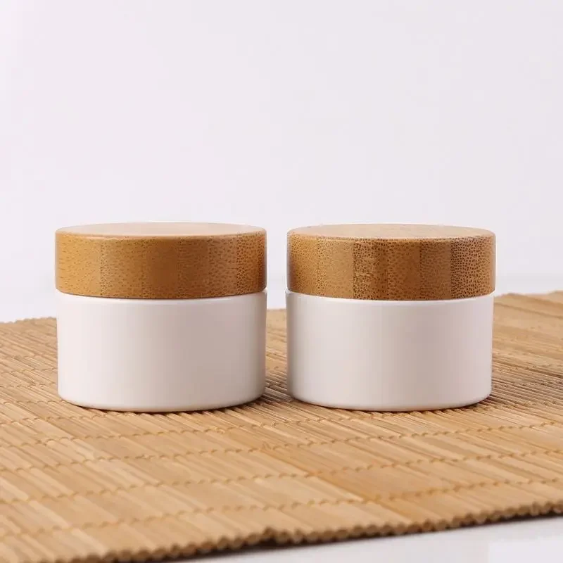 luxury Bamboo Cosmetic package Plastic Cream containers with Bamboo Lid White body scrub Jar with Wooden Cap for skin care cream
luxury Bamboo Cosmetic package Plastic Cream containers with Bamboo Lid White body scrub Jar with Wooden Cap for skin care cream