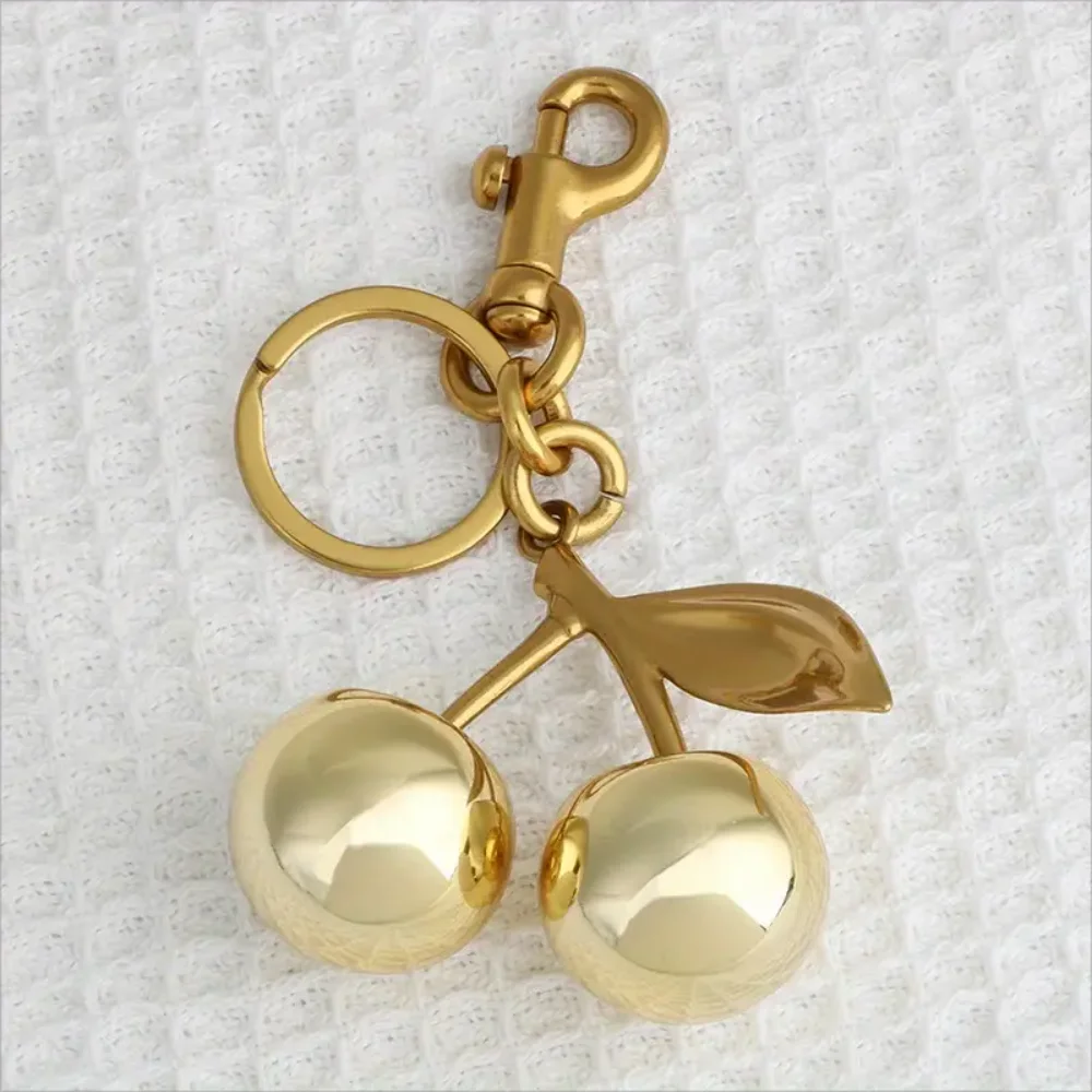 Zinc Alloy Golden Cherry Keychain for Women and Men Fashionable Glitter Keyring Summer Fruit Pendant, Jewelry Bag Accessory, 1Pc
Zinc Alloy Golden Cherry Keychain for Women and Men Fashionable Glitter Keyring Summer Fruit Pendant, Jewelry Bag Accessory, 1Pc