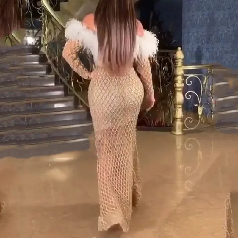 2025 New Women's Sleeved Hollow Out Long Skirt Sprinkled With Gold Feathers And Wrapped Buttocks Dress
2025 New Women's Sleeved Hollow Out Long Skirt Sprinkled With Gold Feathers And Wrapped Buttocks Dress