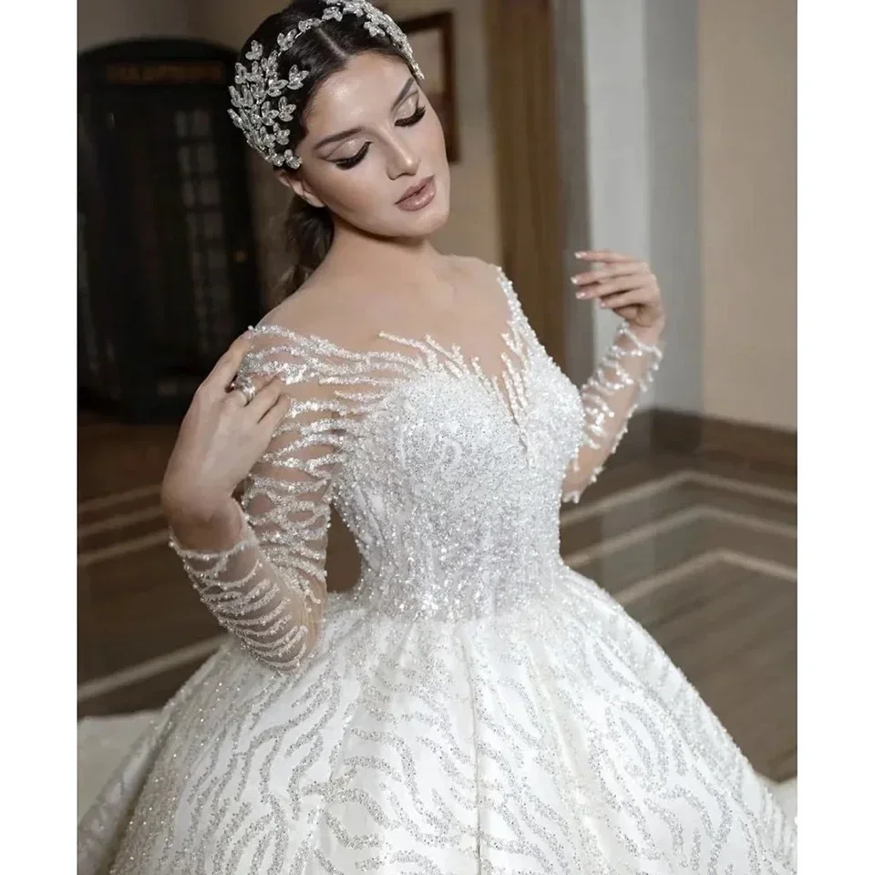 Customized Grace Ball Gown Weddding Dresses Long Sleeve Bridal Gowns Sequin Tulle Lace Beaded Crystal Design Vestido De Noiva
Customized Grace Ball Gown Weddding Dresses Long Sleeve Bridal Gowns Sequin Tulle Lace Beaded Crystal Design Vestido De Noiva
