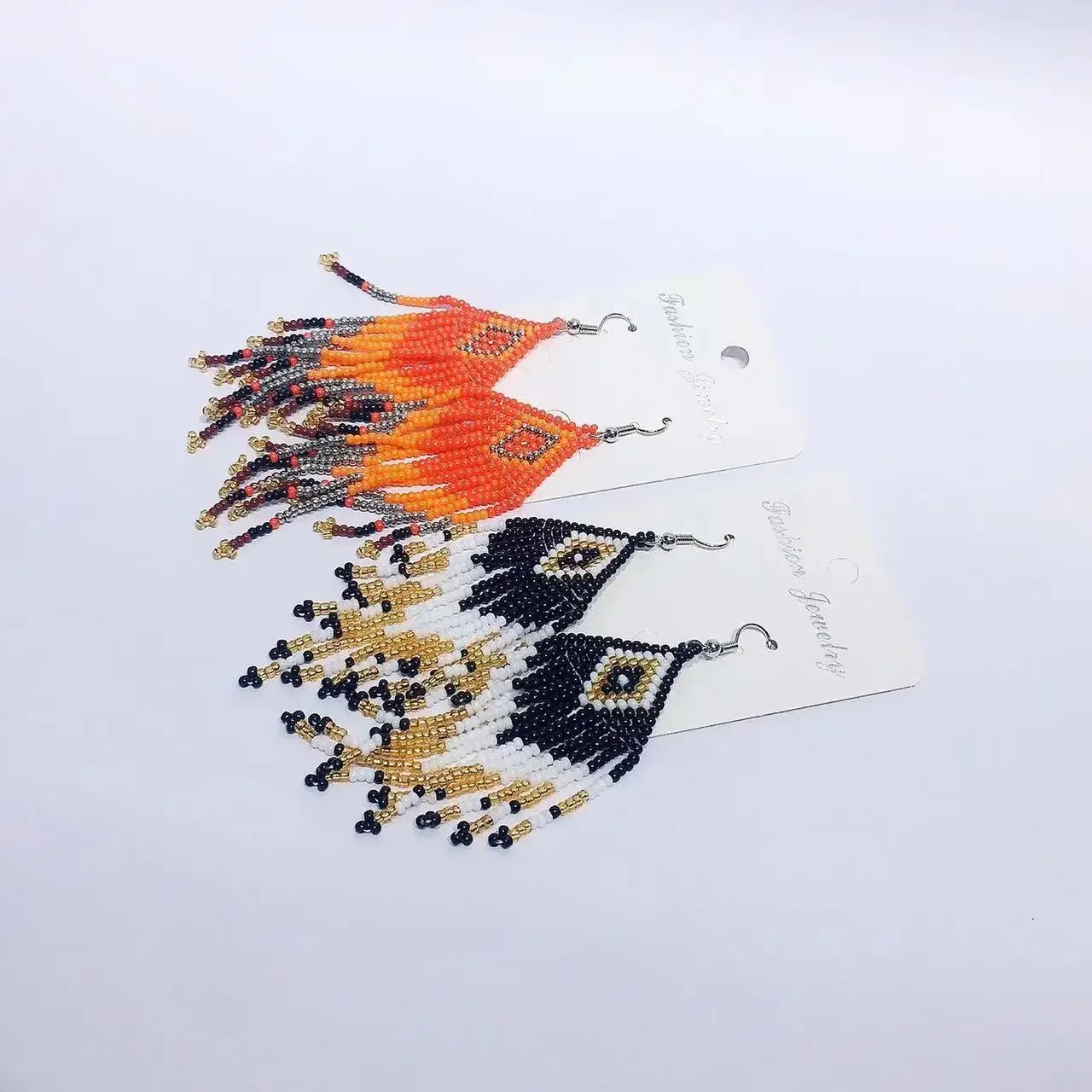 Fringe Earrings Hand knitting Bohemia Beading fashion Color matching Simple geometry alloy ma'am Rice Bead Earrings
Fringe Earrings Hand knitting Bohemia Beading fashion Color matching Simple geometry alloy ma'am Rice Bead Earrings
