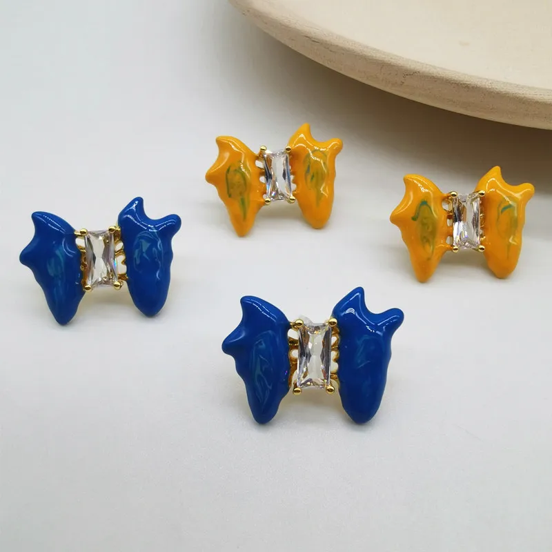 Classic Handpainted Bowknot Blue Orange Drip Oil Clear Zircon Office Lady Daily Commuting Candy Shaped Stud Earrings for Women
Classic Handpainted Bowknot Blue Orange Drip Oil Clear Zircon Office Lady Daily Commuting Candy Shaped Stud Earrings for Women