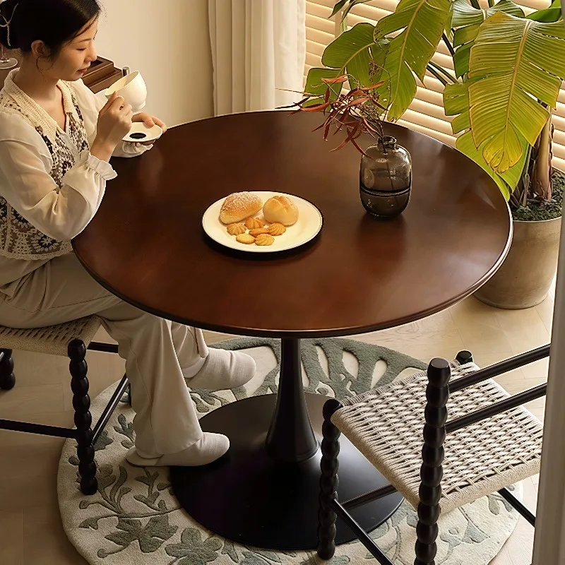 Medieval solid wood, walnut color, tulip round dining table and chairs, small household French style, retro balcony coffee table
Medieval solid wood, walnut color, tulip round dining table and chairs, small household French style, retro balcony coffee table