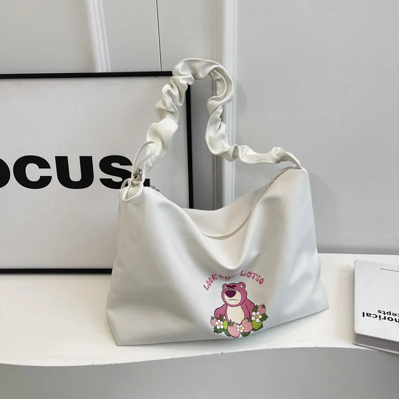 Large capacity strawberry bear canvas bag with pleated shoulder straps, single shoulder diagonal cross bag, casual cloth bag sui
Large capacity strawberry bear canvas bag with pleated shoulder straps, single shoulder diagonal cross bag, casual cloth bag sui