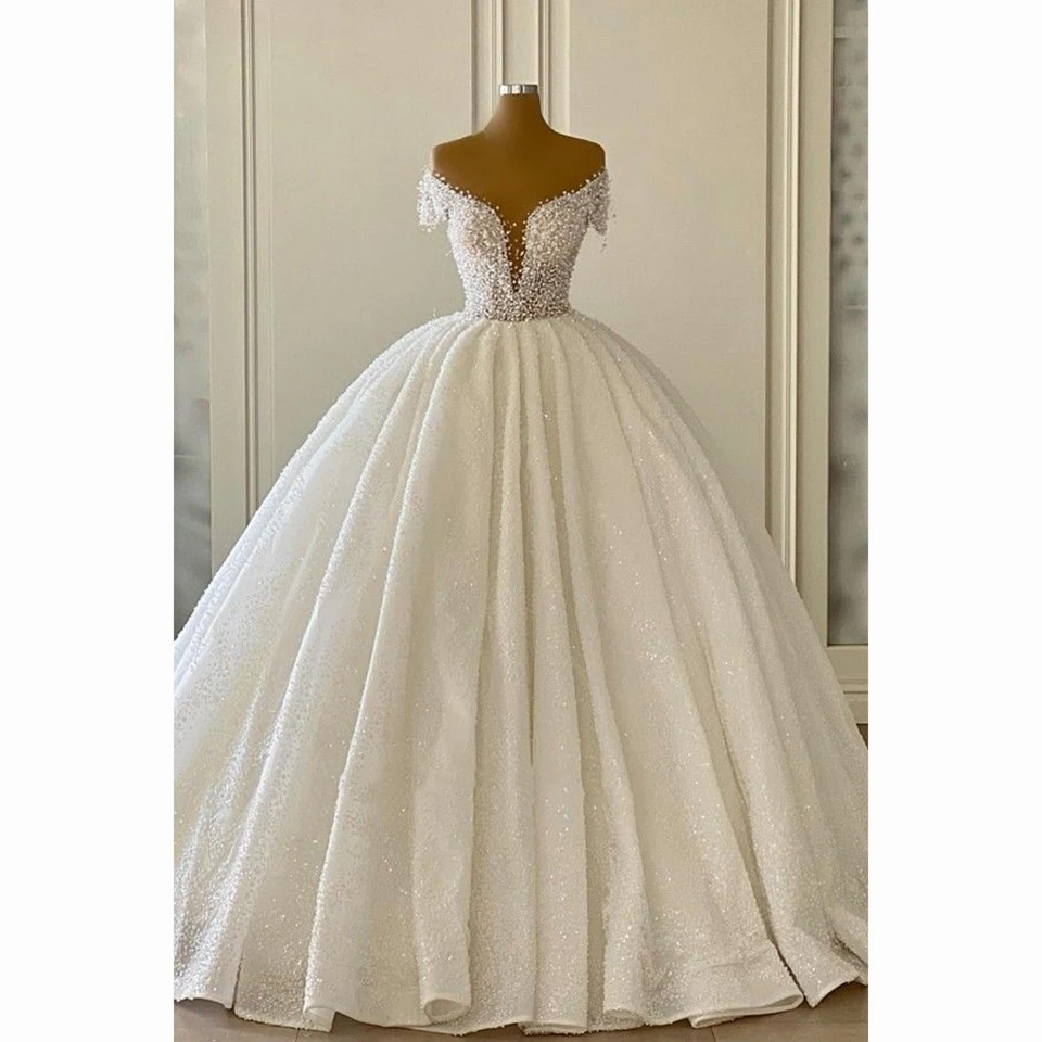 Luxury V-Neck Pearls Ball Gown Wedding Dress 2024 Shinny Off The Shoulder Bridal Gown Floor Length Custom Made Vestido De Novia
Luxury V-Neck Pearls Ball Gown Wedding Dress 2024 Shinny Off The Shoulder Bridal Gown Floor Length Custom Made Vestido De Novia