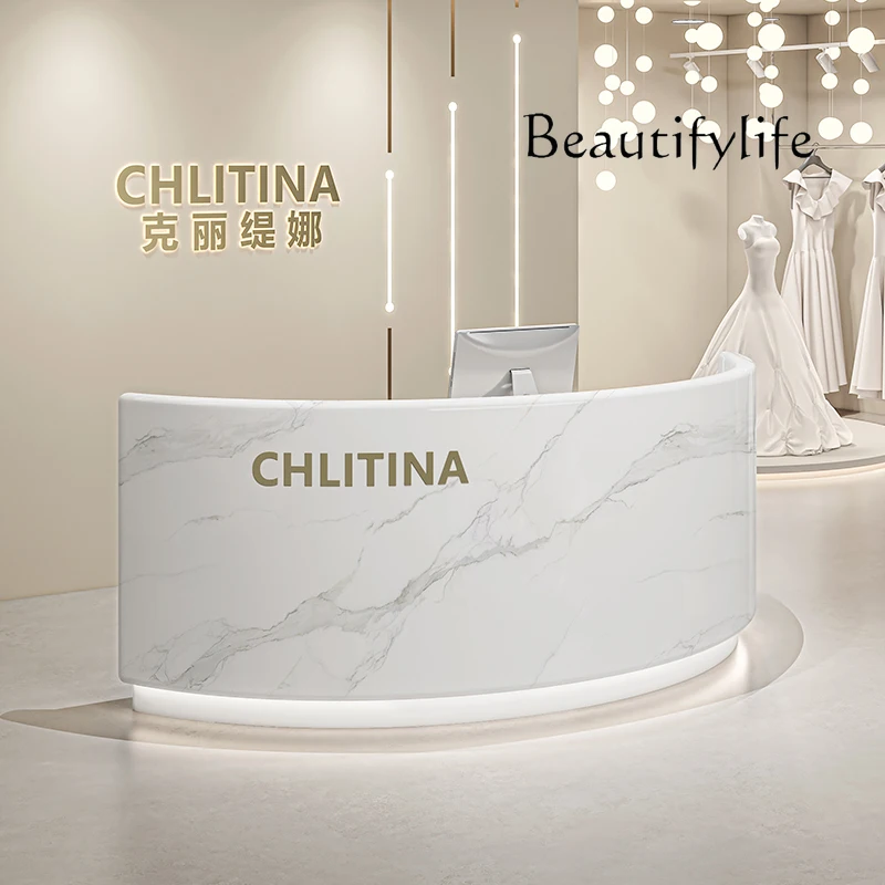 Simple Modern Clothing Store checkout page Company Training Center Curved Cream Wind Reception Front Desk
Simple Modern Clothing Store checkout page Company Training Center Curved Cream Wind Reception Front Desk