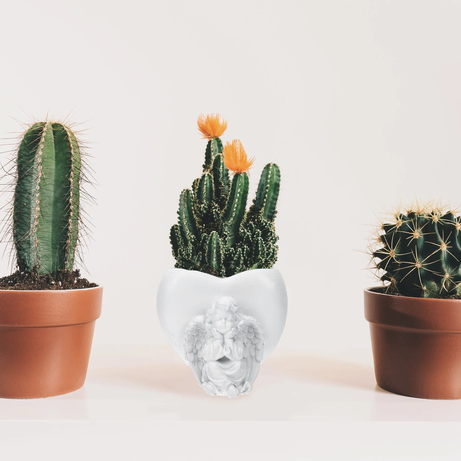 1 шт. креативный цветочный горшок в виде ангела, высококачественный кашпо из смолы для бонсай, для патио, дорожек, сада, ландшафтного дизайна
1 шт. креативный цветочный горшок в виде ангела, высококачественный кашпо из смолы для бонсай, для патио, дорожек, сада, ландшафтного дизайна