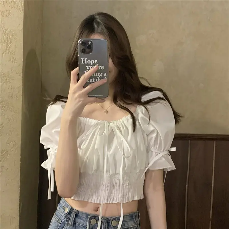 Summer New White Pleated Lacing Sexy Short Shirt Tops Solid Color Short Sleeve Youth Sweet T Shirts Fashion Trend Women Clothing
Summer New White Pleated Lacing Sexy Short Shirt Tops Solid Color Short Sleeve Youth Sweet T Shirts Fashion Trend Women Clothing