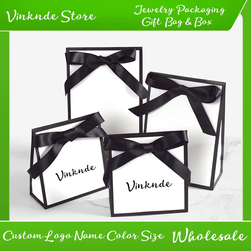 Custom Logo Black/White Cardboard Paper Shopping Bag with Bow Portable Handbag Gift Packing Tote with Handles for Wedding Gifts
Custom Logo Black/White Cardboard Paper Shopping Bag with Bow Portable Handbag Gift Packing Tote with Handles for Wedding Gifts