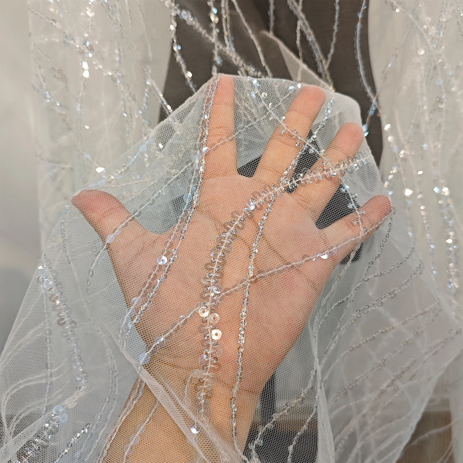 white shiny water ripple sequin embroidered mesh yarn Lace mesh fabric Wedding dress Performance costume Veil Designer tulle
white shiny water ripple sequin embroidered mesh yarn Lace mesh fabric Wedding dress Performance costume Veil Designer tulle