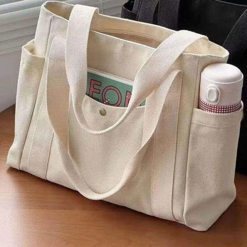 Large Capacity Canvas Tote Bag for Commuting to Work Stylish Versatile Outdoor Bag High Aesthetic Value Suitable for Students
Large Capacity Canvas Tote Bag for Commuting to Work Stylish Versatile Outdoor Bag High Aesthetic Value Suitable for Students
