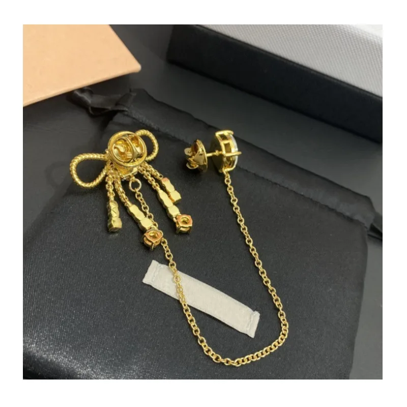New Water Drop Crystal Diamond Temperament Pin Bow Fringed Brooch Copper Gold-plated Micro-inlaid Zircon Dress Women
New Water Drop Crystal Diamond Temperament Pin Bow Fringed Brooch Copper Gold-plated Micro-inlaid Zircon Dress Women