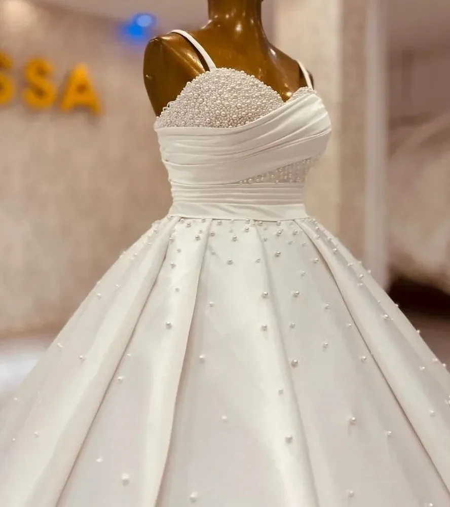 Exquisite Pearls Wedding Dresses 2027 Spaghetti Straps Pleat Draped Ball Gowns Floor Length Bride Bridal Gowns Vestidos
Exquisite Pearls Wedding Dresses 2027 Spaghetti Straps Pleat Draped Ball Gowns Floor Length Bride Bridal Gowns Vestidos