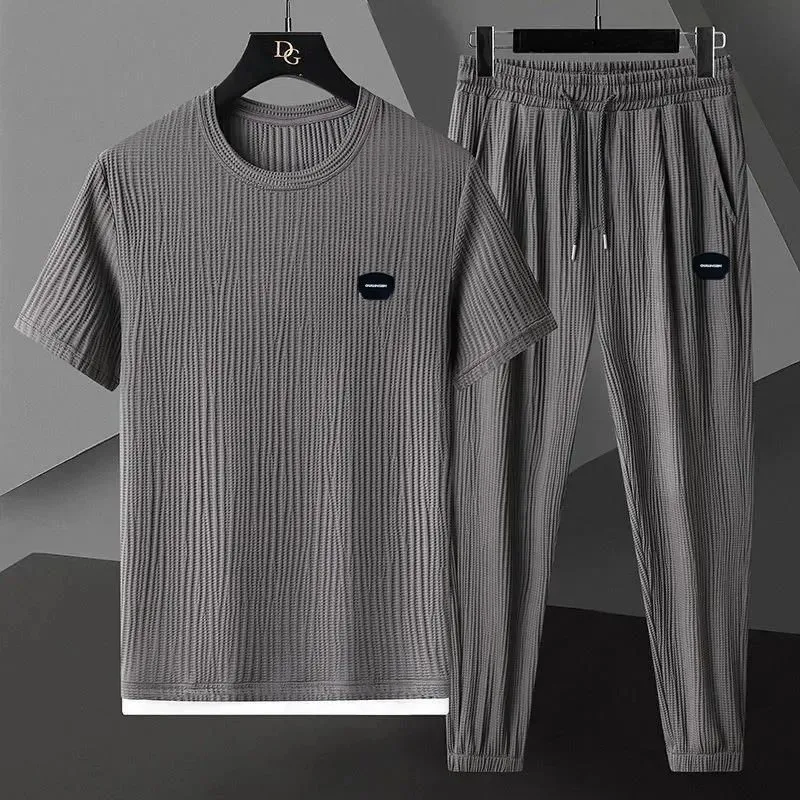 Men's Ice Silk Casual Sports Suit 2026 New Summer Breathable Thin T-Shirt + Pants Two Piece Set Pleated High Quality Tracksuit
Men's Ice Silk Casual Sports Suit 2026 New Summer Breathable Thin T-Shirt + Pants Two Piece Set Pleated High Quality Tracksuit