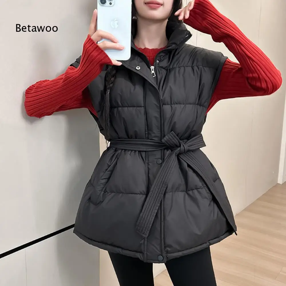 Loose Fit Quilted Padded Sleeveless Waistcoat Stand Collar Full Snap Front Self Fabric Belt Tied Waist Winter Vest Top
Loose Fit Quilted Padded Sleeveless Waistcoat Stand Collar Full Snap Front Self Fabric Belt Tied Waist Winter Vest Top