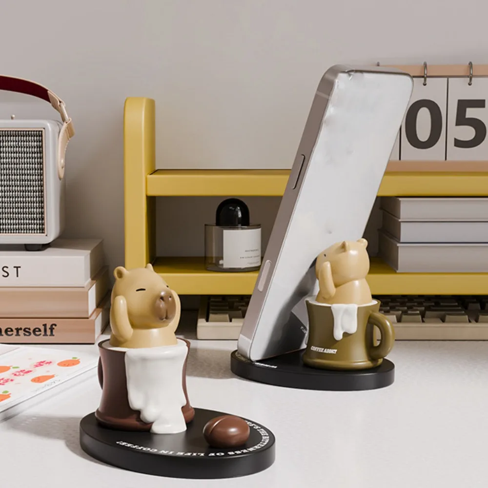 Coffee Cup Capybara Doll Phone Holder Animal Figurines Ornament Capybara Mobile Phone Stand Creative Cartoon Capybra Model Toy
Coffee Cup Capybara Doll Phone Holder Animal Figurines Ornament Capybara Mobile Phone Stand Creative Cartoon Capybra Model Toy