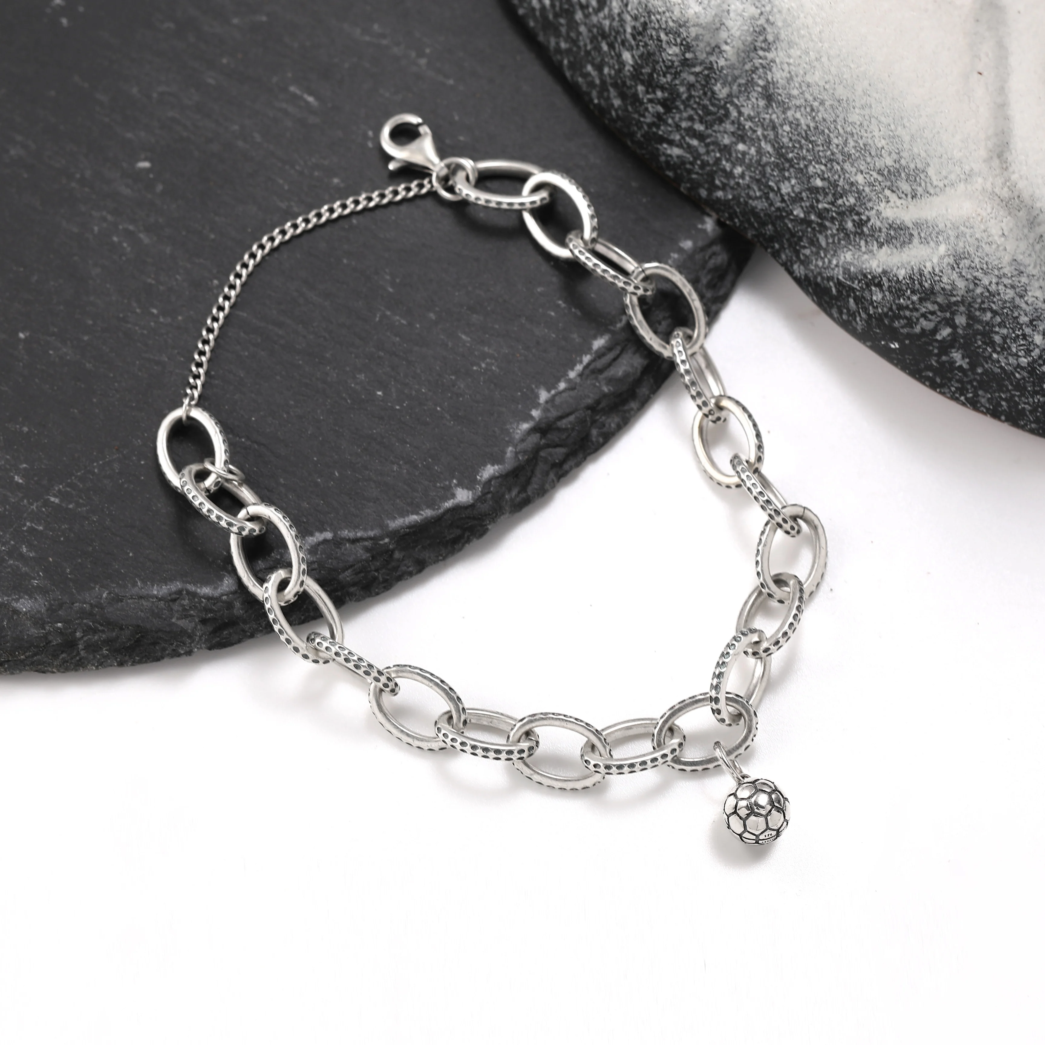 Genuine 925 sterling silver exquisite Textured Oval Charm Bracelet paired with a Football pendant
Genuine 925 sterling silver exquisite Textured Oval Charm Bracelet paired with a Football pendant