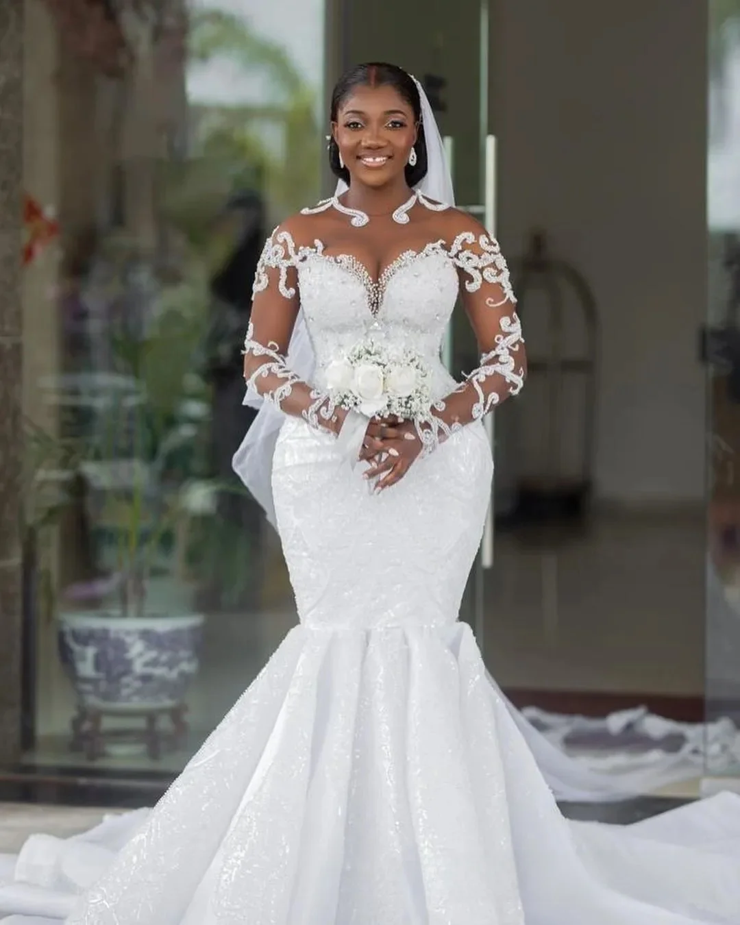 Африканское свадебное платье по индивидуальному заказу, свадебные платья больших размеров, свадебные платья русалки с прозрачным вырезом и длинными рукавами, кружевные платья с жемчугом и бисером 
Африканское свадебное платье по индивидуальному заказу, свадебные платья больших размеров, свадебные платья русалки с прозрачным вырезом и длинными рукавами, кружевные платья с жемчугом и бисером