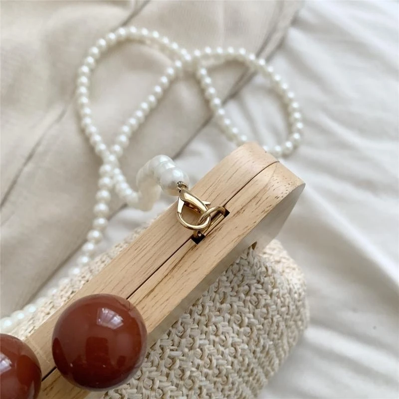 Womens Elegant Woven Straw Crossbody Bag with Pearl Beaded Chain Kiss Lock Clip Small Shoulder Bag Beach Purse
Womens Elegant Woven Straw Crossbody Bag with Pearl Beaded Chain Kiss Lock Clip Small Shoulder Bag Beach Purse