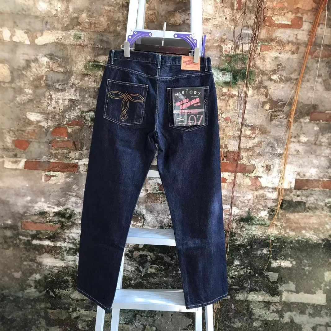 100% хлопок, вес 13,2 унции, прямые джинсы с необработанными кромками для мужчин, осень 2023, классические дугообразные джинсовые брюки OKONKWO 
100% хлопок, вес 13,2 унции, прямые джинсы с необработанными кромками для мужчин, осень 2023, классические дугообразные джинсовые брюки OKONKWO