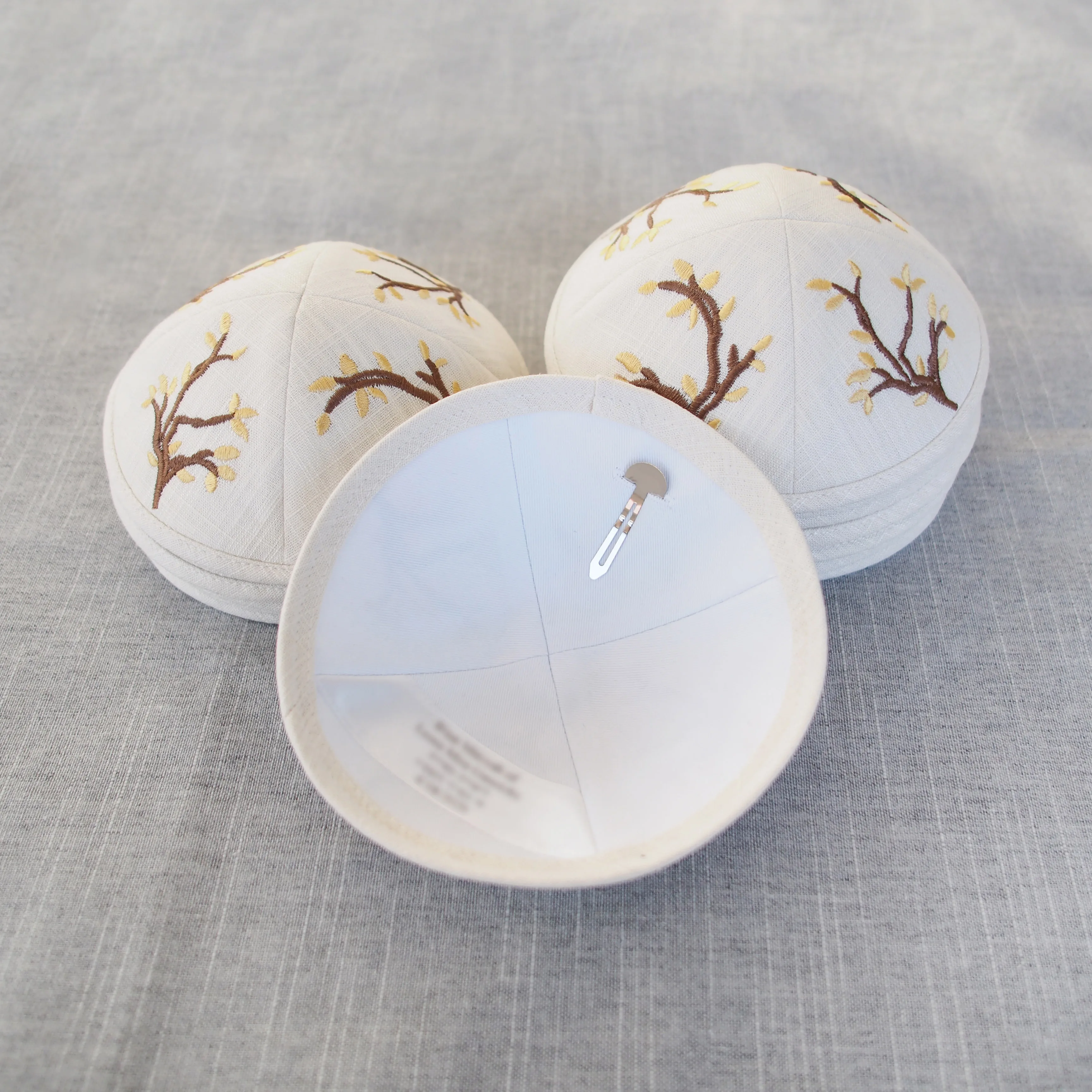 Ivory white linen kippah with custom embroidery and digital printing, suitable for Jewish coming-of-age ceremonies and weddings.
Ivory white linen kippah with custom embroidery and digital printing, suitable for Jewish coming-of-age ceremonies and weddings.
