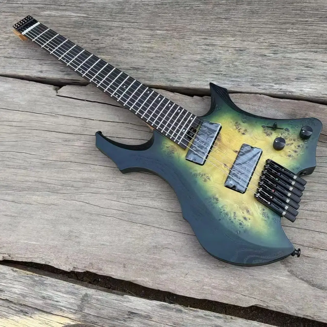 7 String Headless Electric Guitar Green fades Yellow Burl Maple, Fanned Frets Active Pickups 9 Piece Neck, Stainless Steel Fret
7 String Headless Electric Guitar Green fades Yellow Burl Maple, Fanned Frets Active Pickups 9 Piece Neck, Stainless Steel Fret