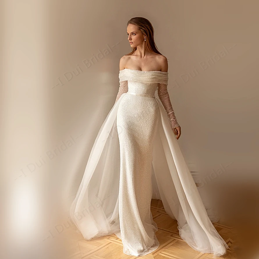 Off Shoulder Luxury Beaded Bodycon Wedding Dress with Detachable Train Long Sleeve High Quality Factory Custom Made
Off Shoulder Luxury Beaded Bodycon Wedding Dress with Detachable Train Long Sleeve High Quality Factory Custom Made