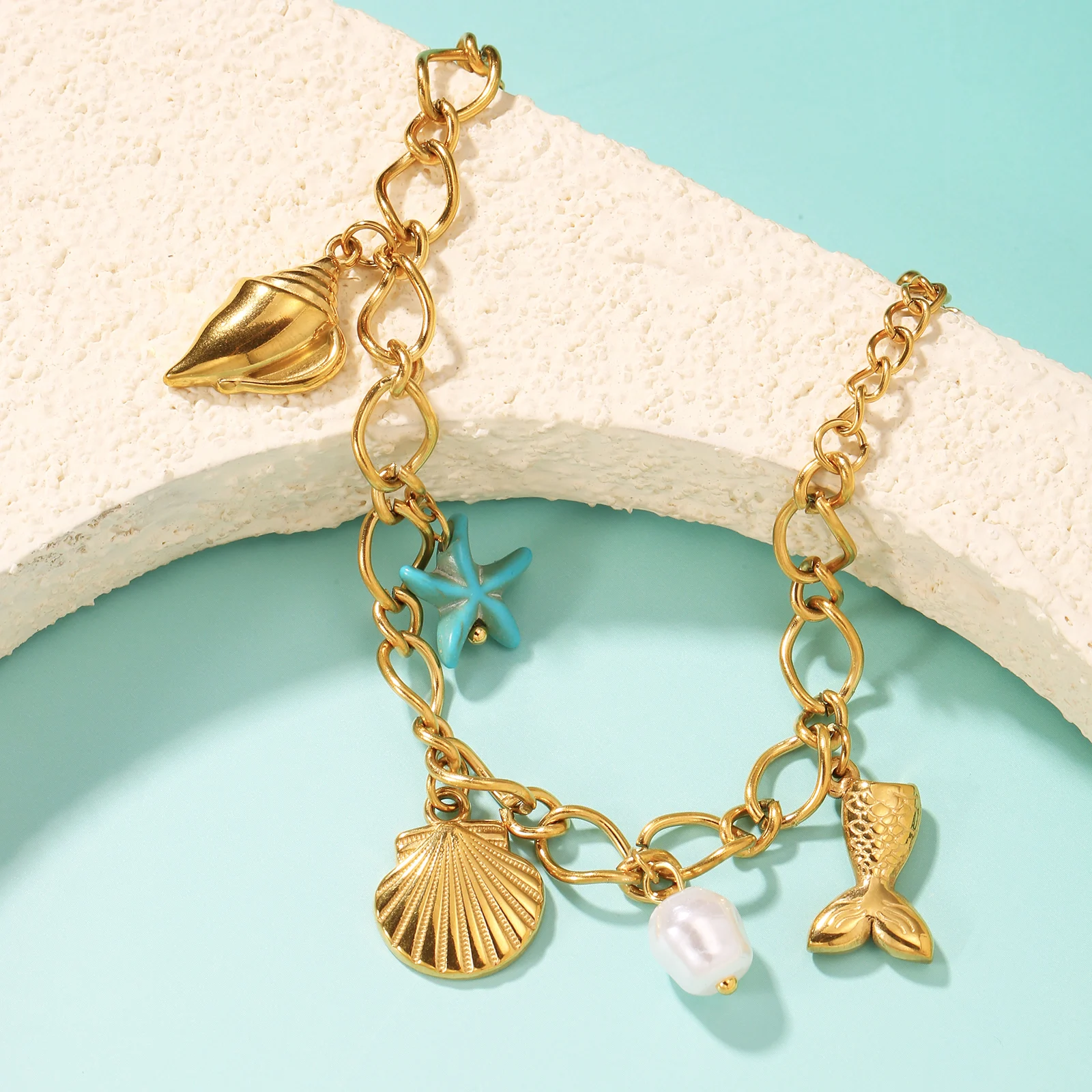 Golden Tone Stainless Steel Ocean Charm Bracelet with Shell Starfish and Mermaid Tail Pendants for Women
Golden Tone Stainless Steel Ocean Charm Bracelet with Shell Starfish and Mermaid Tail Pendants for Women