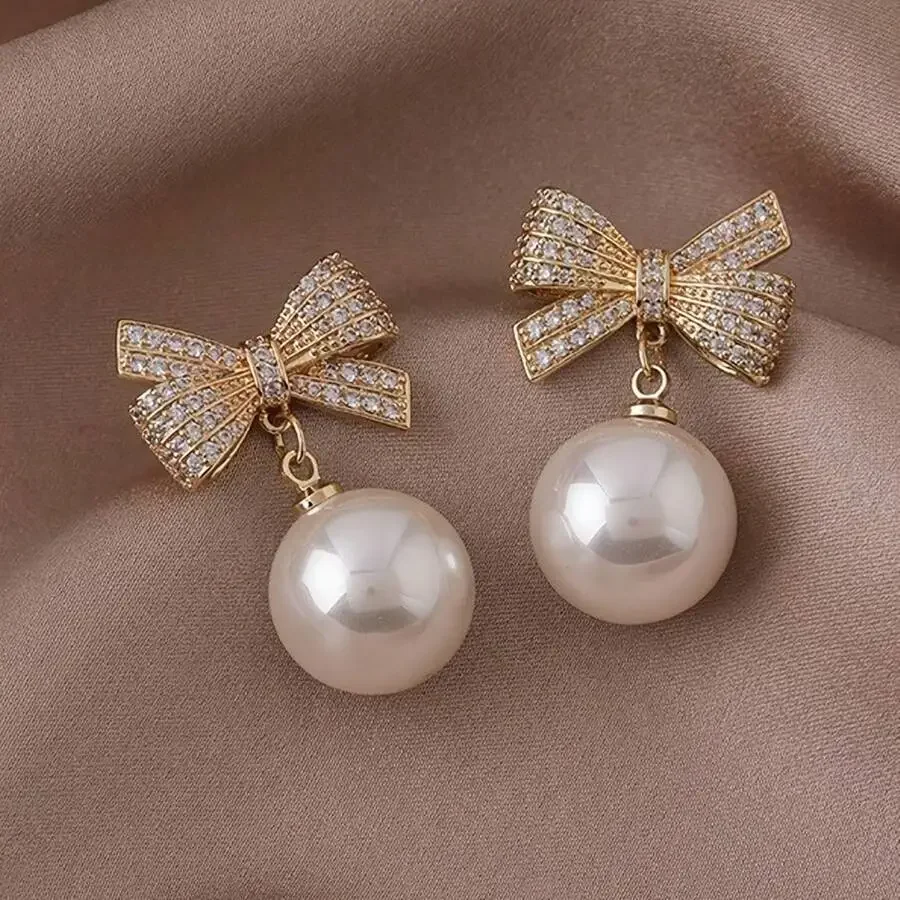 Elegant Bow Knot Dangle Earrings With Faux Pearl And Zirconia Inlaid Zinc Alloy For Women
Elegant Bow Knot Dangle Earrings With Faux Pearl And Zirconia Inlaid Zinc Alloy For Women
