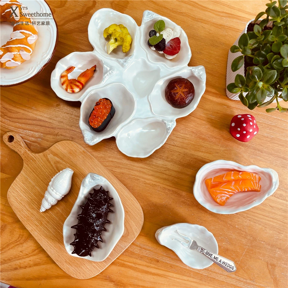 Oyster series seasoning plate, underglaze color dipping plate, retro oyster shaped multi-grid plate
Oyster series seasoning plate, underglaze color dipping plate, retro oyster shaped multi-grid plate