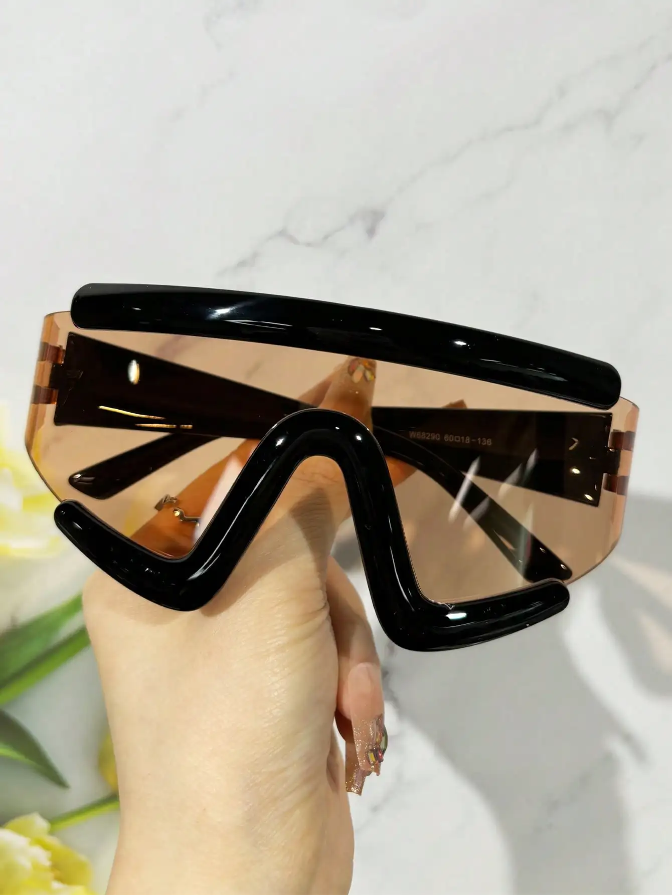 Oversized Shield-Style Sunglasses with Black Frame and Amber Lens
Oversized Shield-Style Sunglasses with Black Frame and Amber Lens