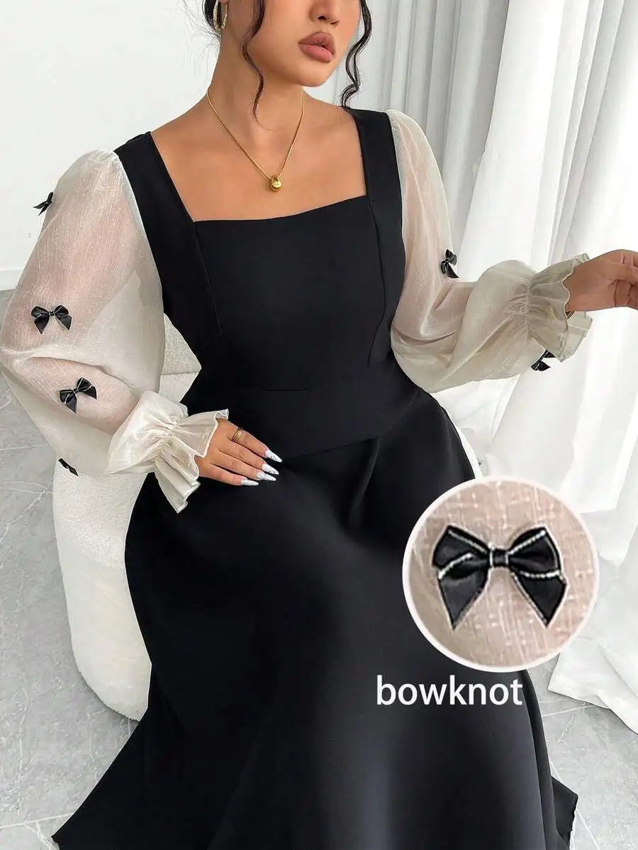 Black Square Neck Dress with Sheer Puff Sleeves and Bow Accents
Black Square Neck Dress with Sheer Puff Sleeves and Bow Accents