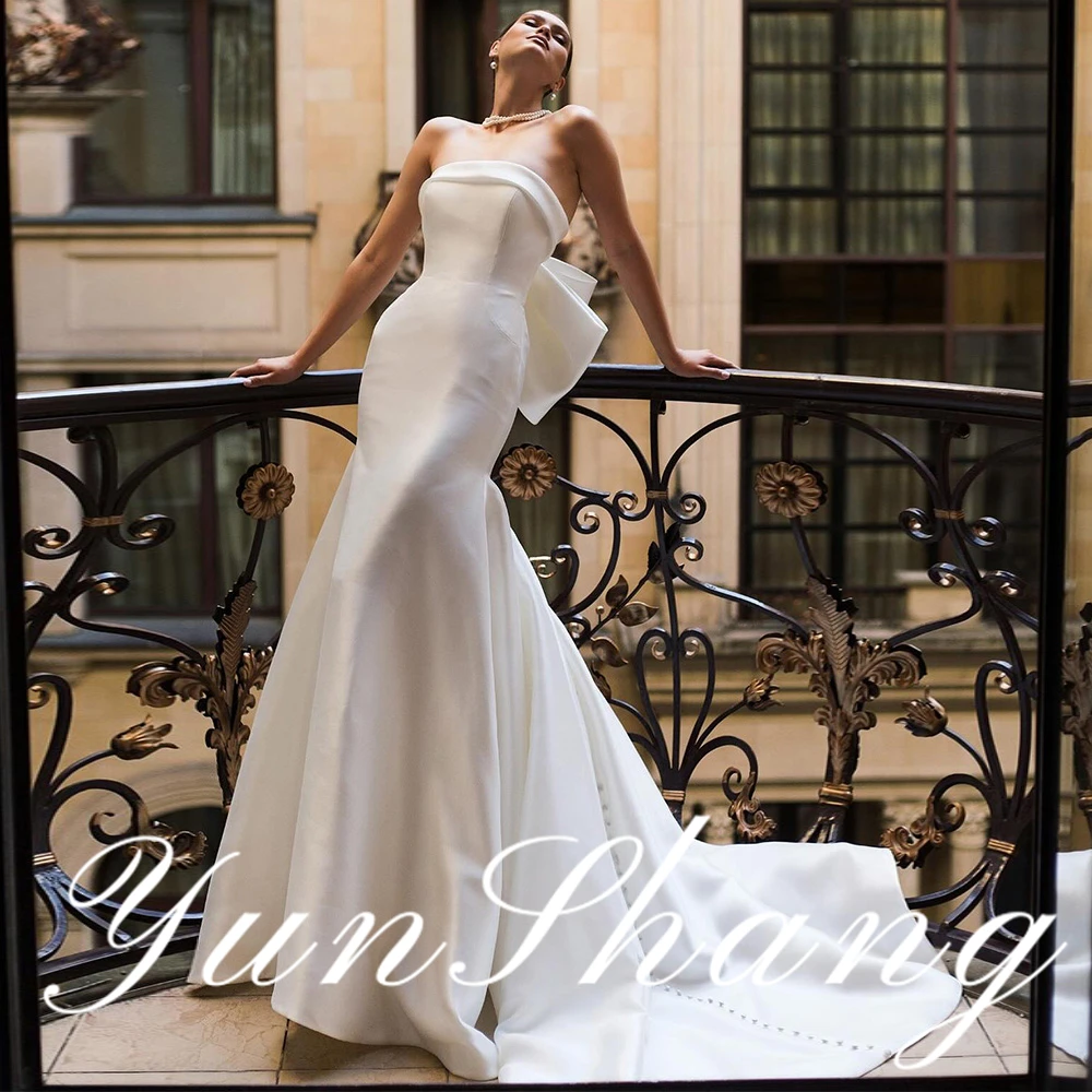 YunShang Customized Strapless Mermaid Wedding Dress Back Bow Detail Pearl Button Embellished Satin Bridal Gown Elegant Ceremony
YunShang Customized Strapless Mermaid Wedding Dress Back Bow Detail Pearl Button Embellished Satin Bridal Gown Elegant Ceremony