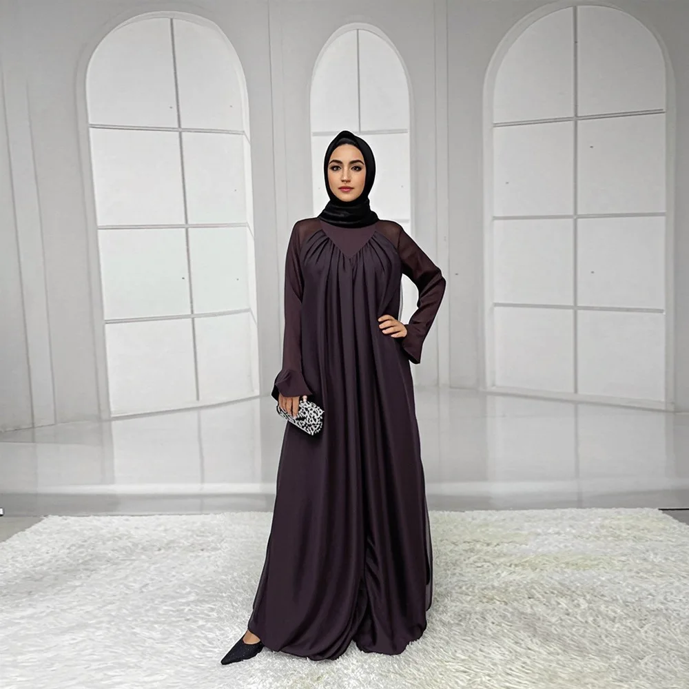 New style fashionable long dress in the Middle East of Turkey. Abaya with patchwork design, flowing bows, a Muslim women's robe.
New style fashionable long dress in the Middle East of Turkey. Abaya with patchwork design, flowing bows, a Muslim women's robe.