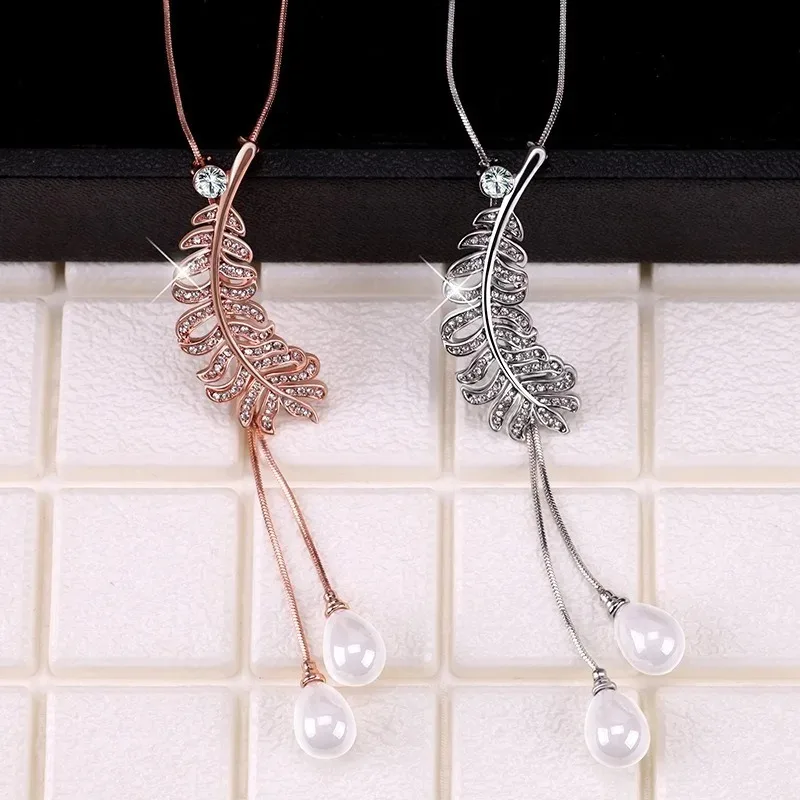 Autumn and winter universal leaf sweater chain, women's long feather necklace, retro necklace, fashionable clothing necklace
Autumn and winter universal leaf sweater chain, women's long feather necklace, retro necklace, fashionable clothing necklace